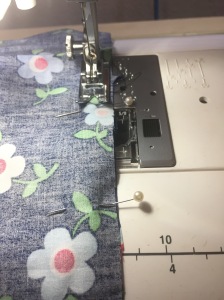 On the right side, start your seam at the notch.  Use small stitches,  you want this to be secure.